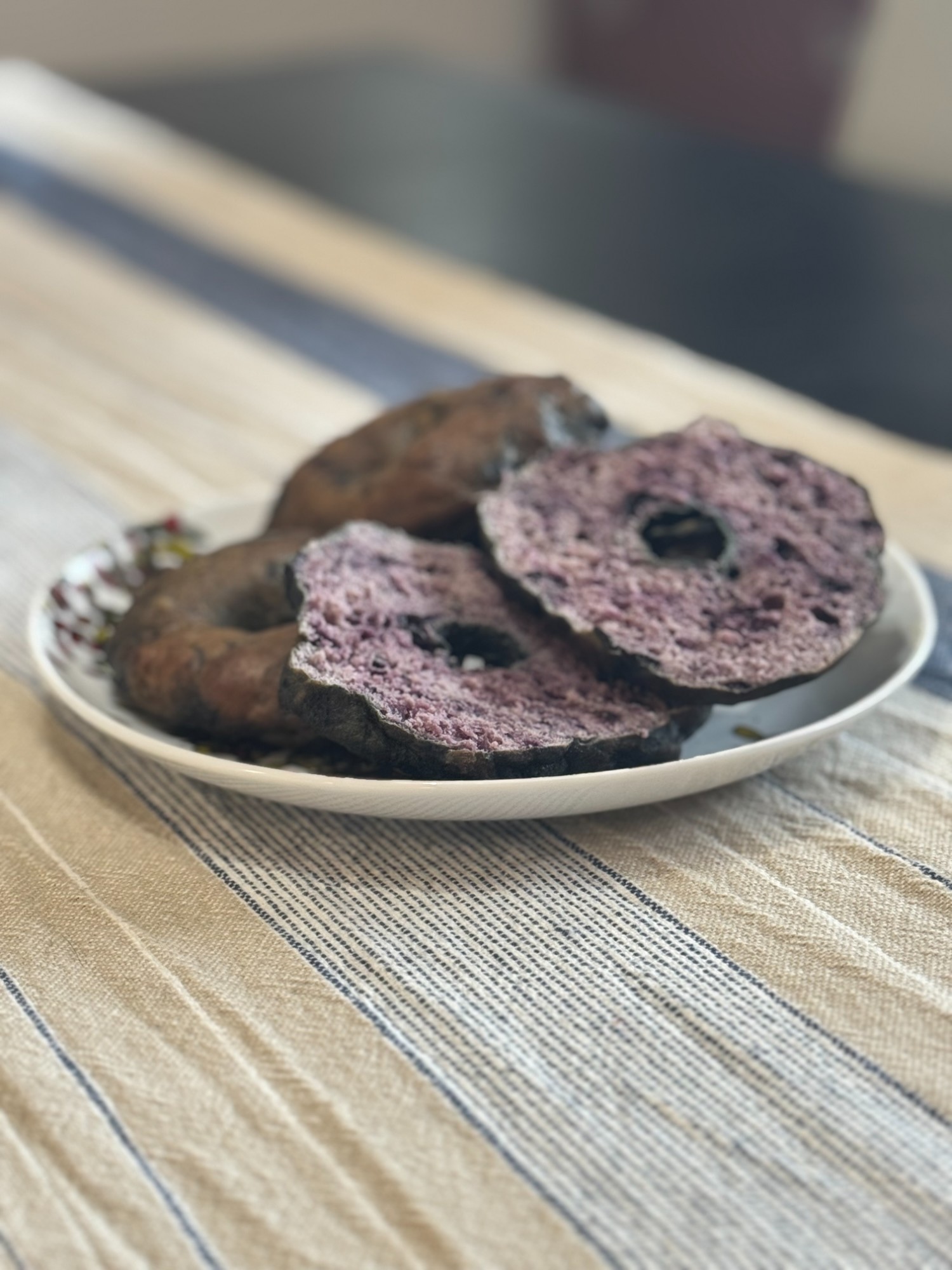 Beautiful blueberry sourdough bagels in a basket