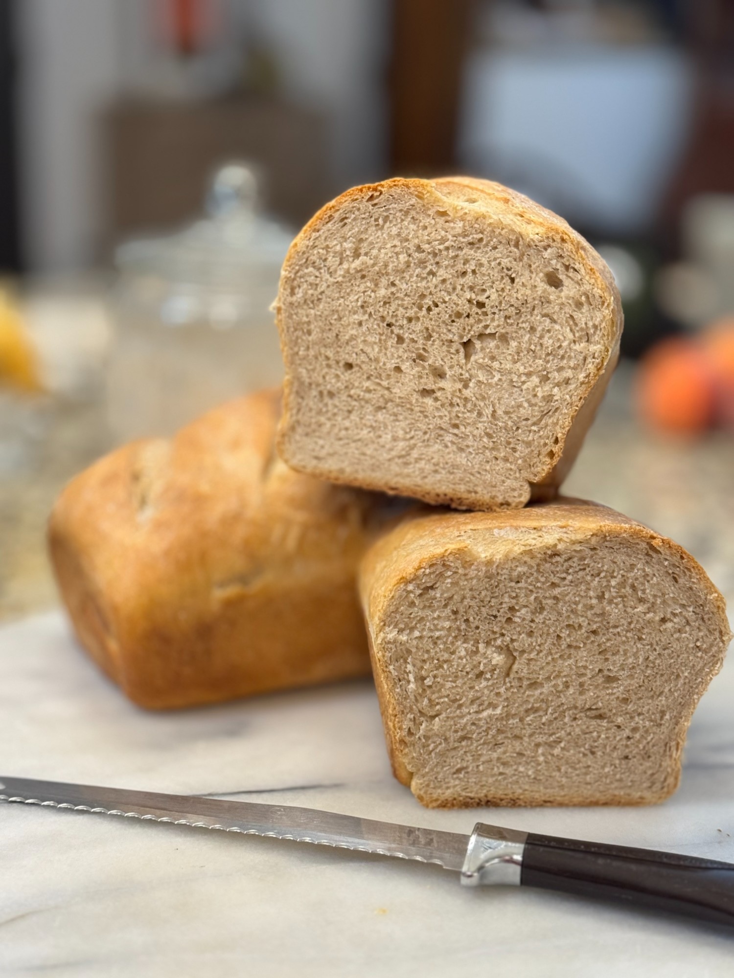 Freshly sliced sourdough sandwich loaves showing a beautiful open crumb, made with Edgar Allan Dough